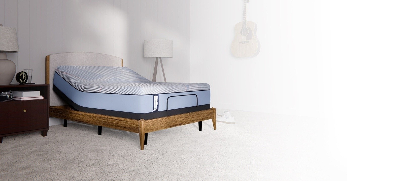 Posturepedic Plus Hybrid mattress on adjustable base in a styled room