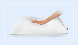 a hand pressing on a sealy adjustable pillow