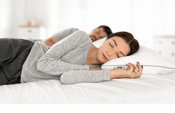 two adults sleeping on an adjustable pillow