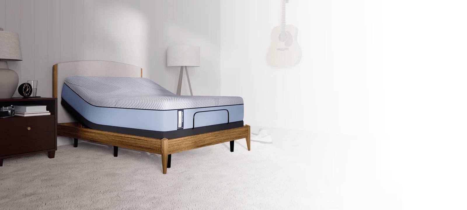 Posturepedic Plus Hybrid mattress on adjustable base in a styled room