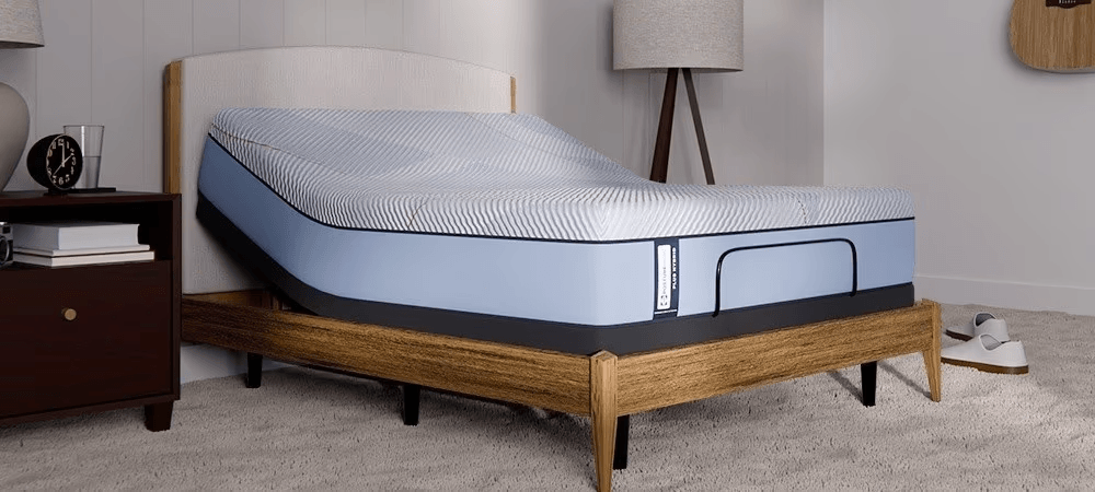 Posturepedic Plus Hybrid mattress on adjustable base in a styled room - mobile
